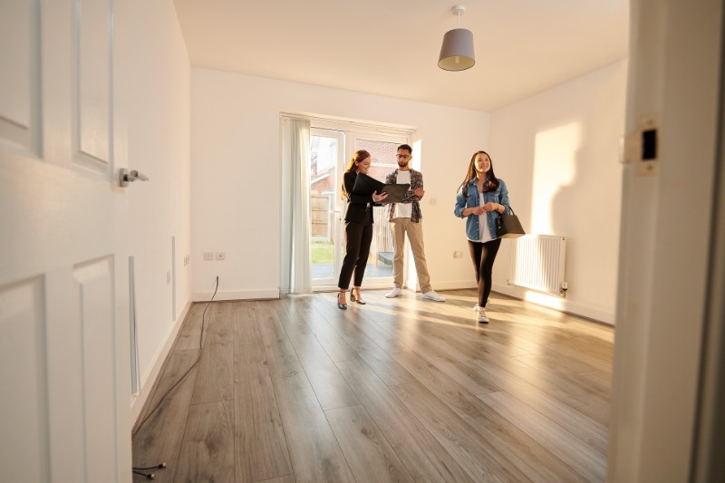 A real estate agent with her client inspectioning the new construction homes in Ridgewood, NJ