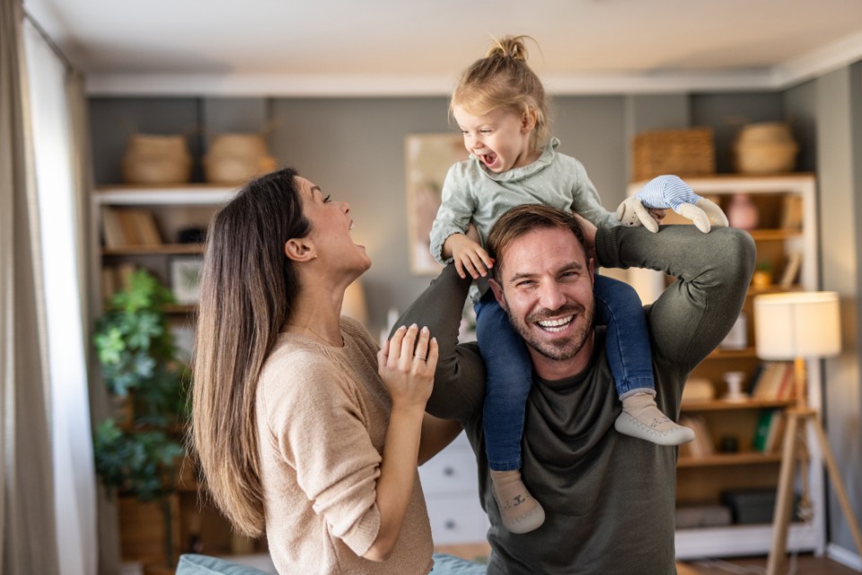 Happy family playing together at home